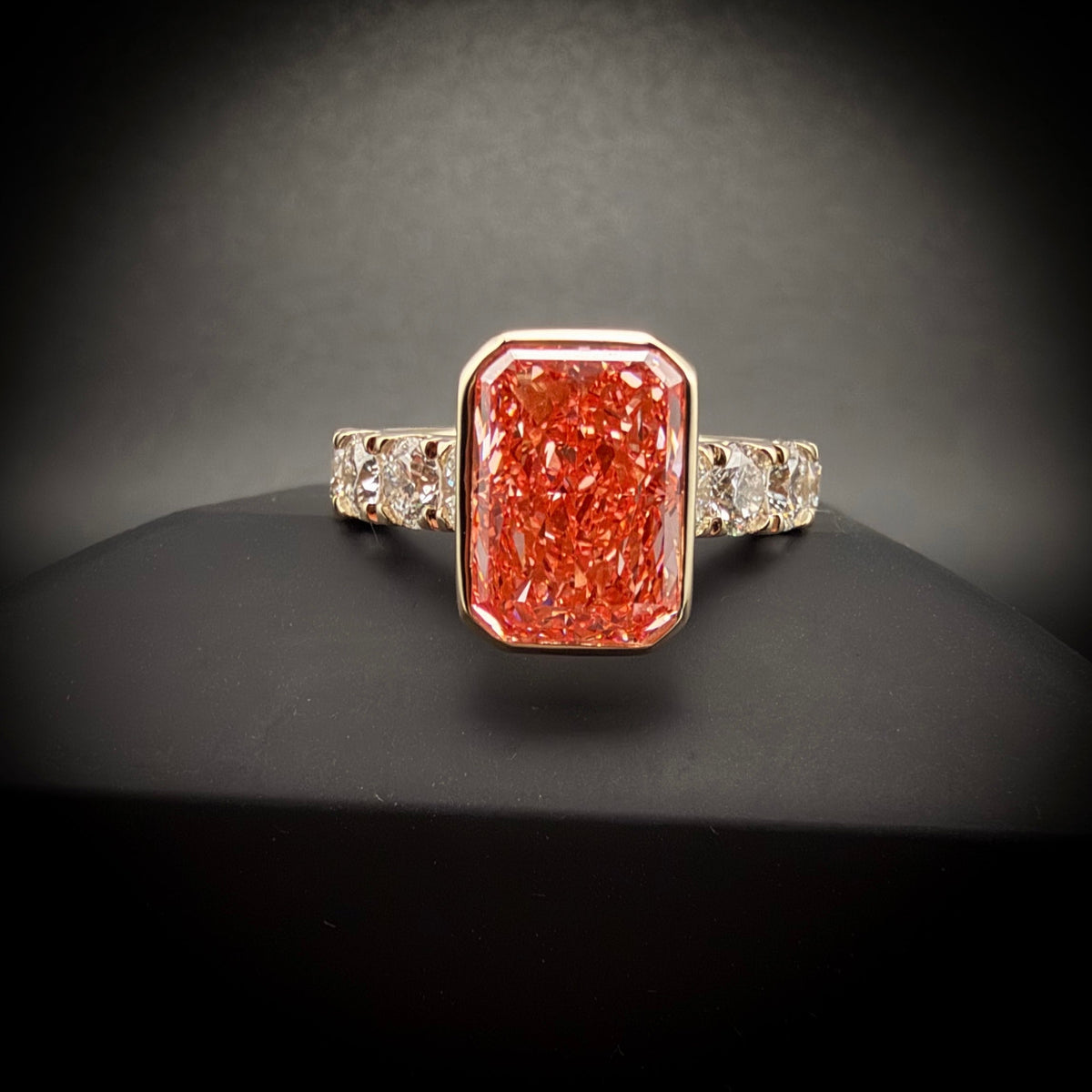 5 carat radiant fancy pink lab grown diamond full bezel setting with 2 carats total in 14 k yellow gold