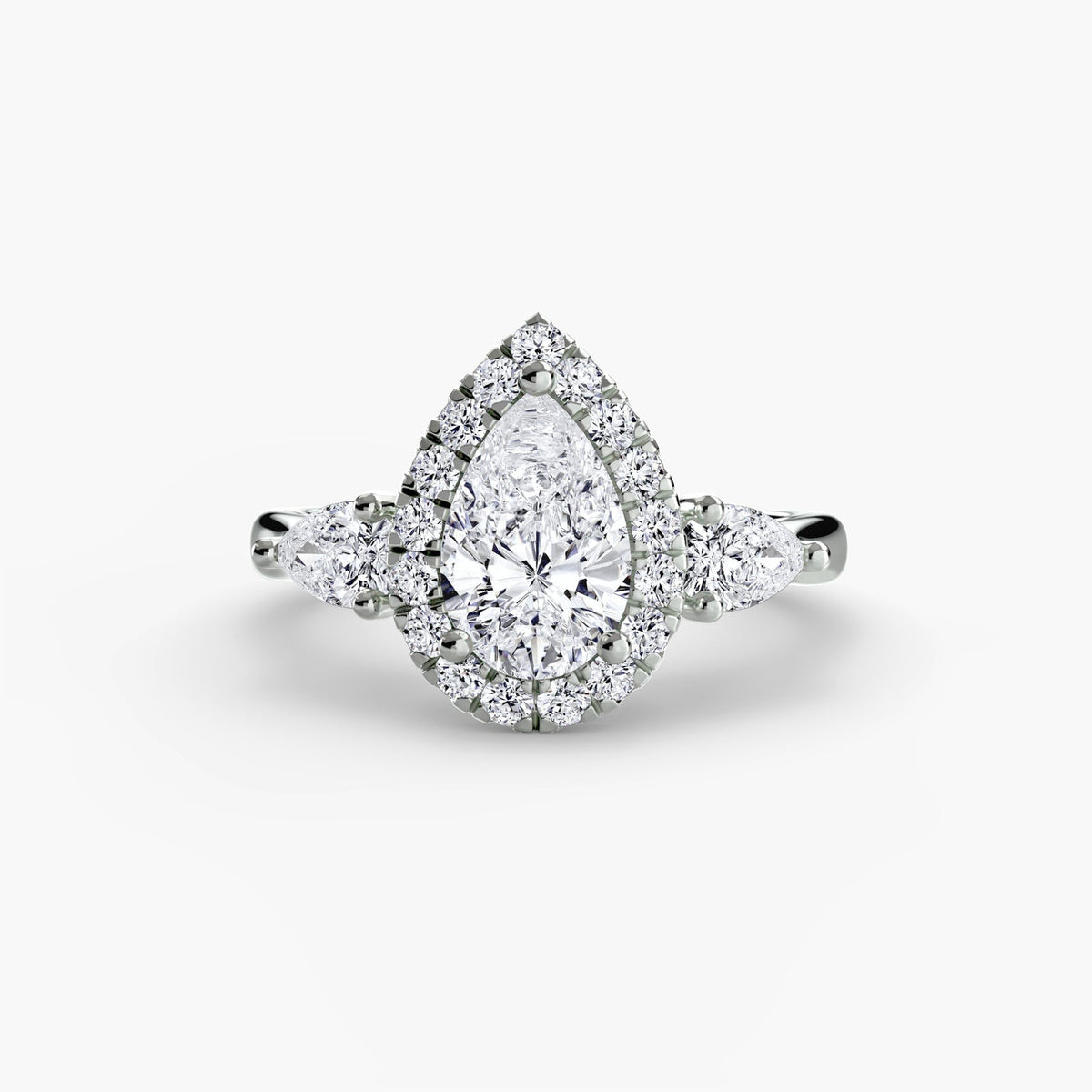 Pear-shaped lab-grown diamond engagement ring with a halo and pear side stones