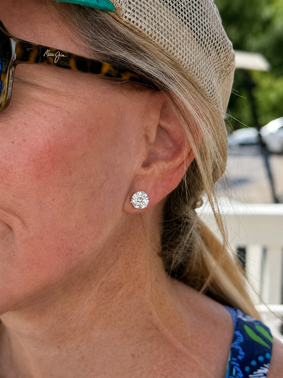 woman wearing a 2.5 carat diamond stud earring