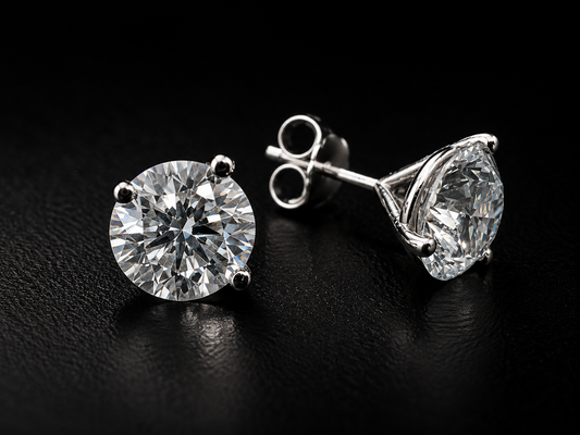 Pair of diamond stud earrings on a dark background
